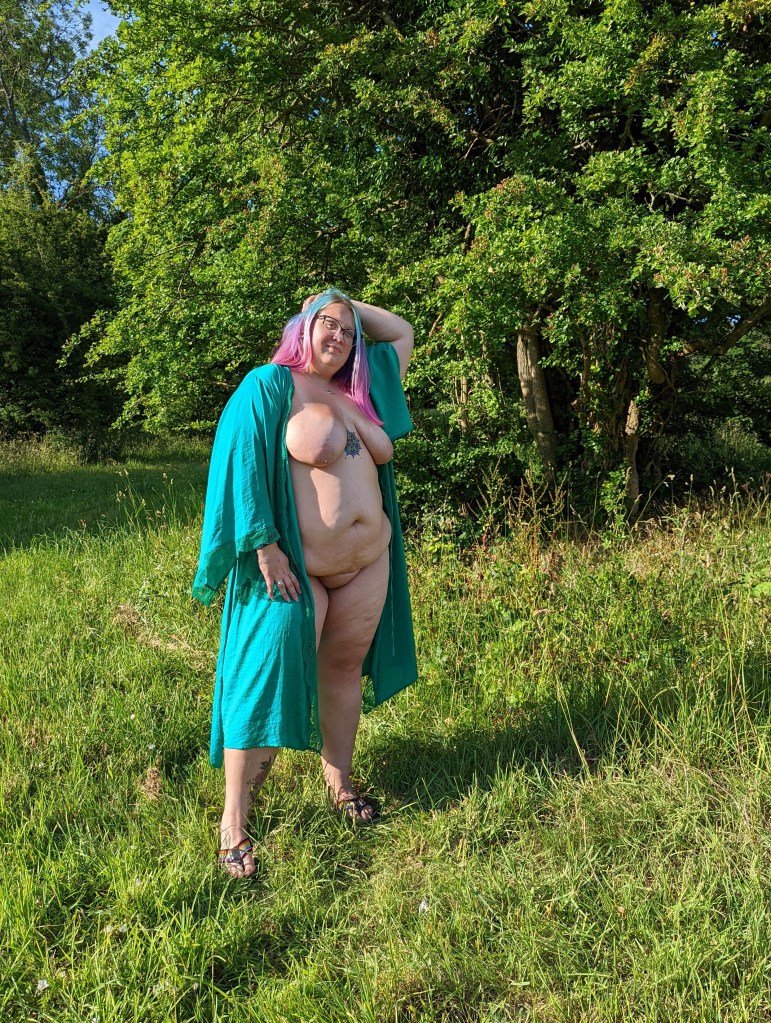 Katie, naked with blue/green robe.