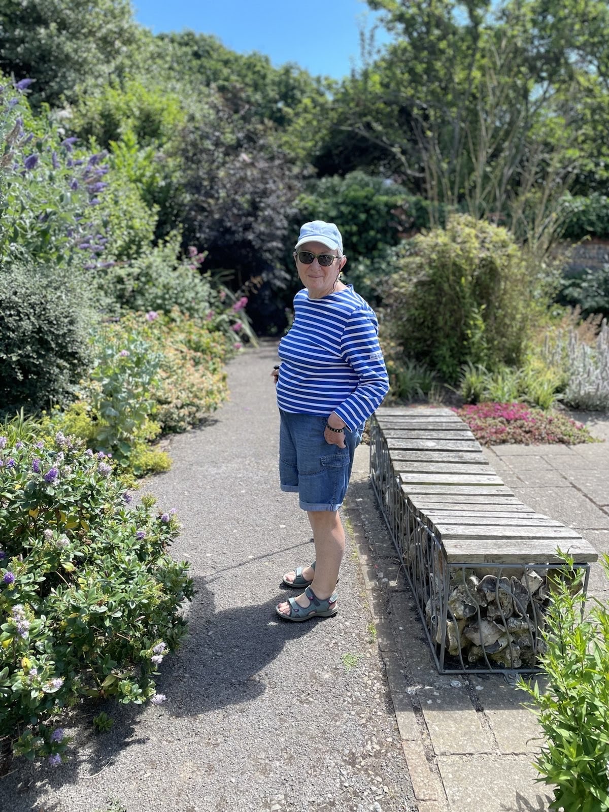 Sarah standing, back view in a mirror.