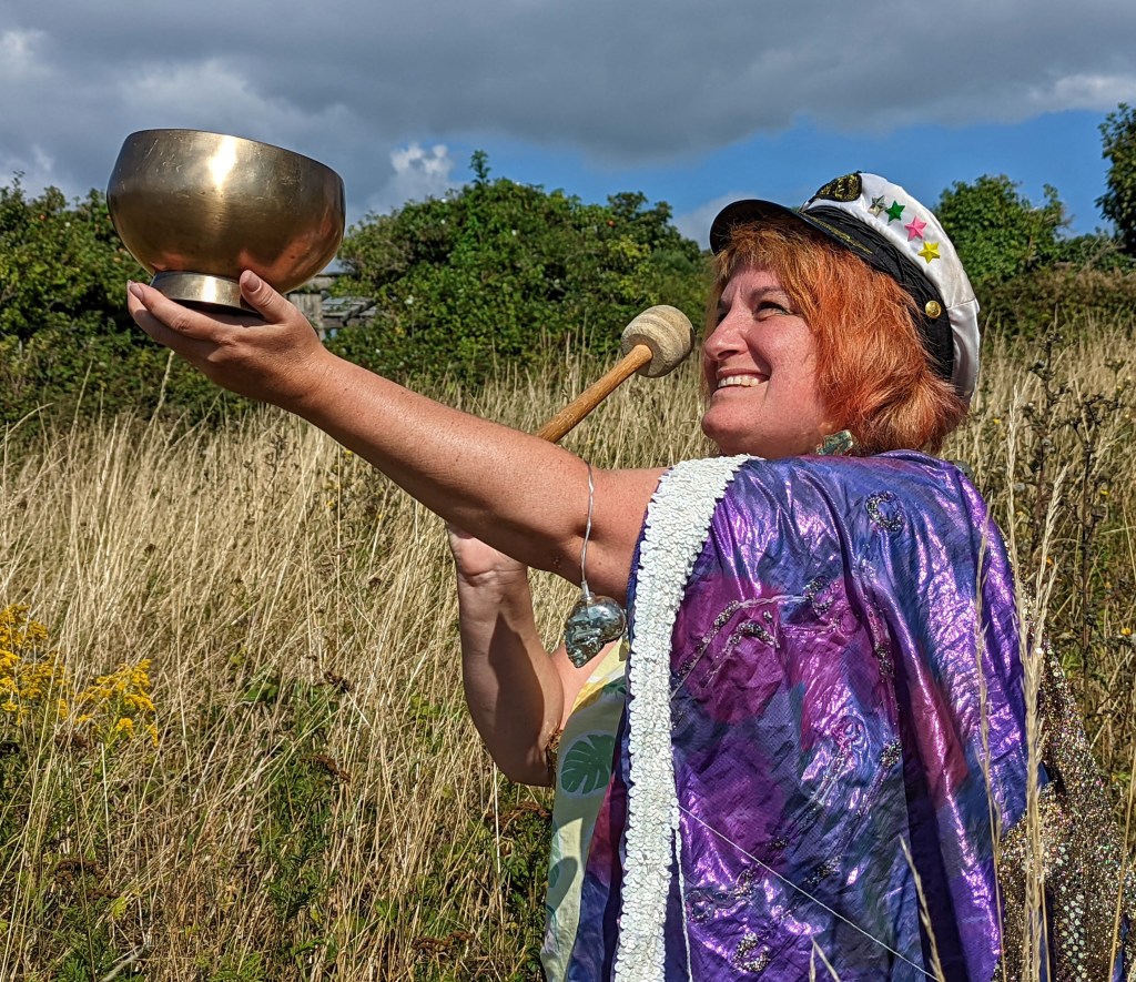 Dolly striking singing bowl.