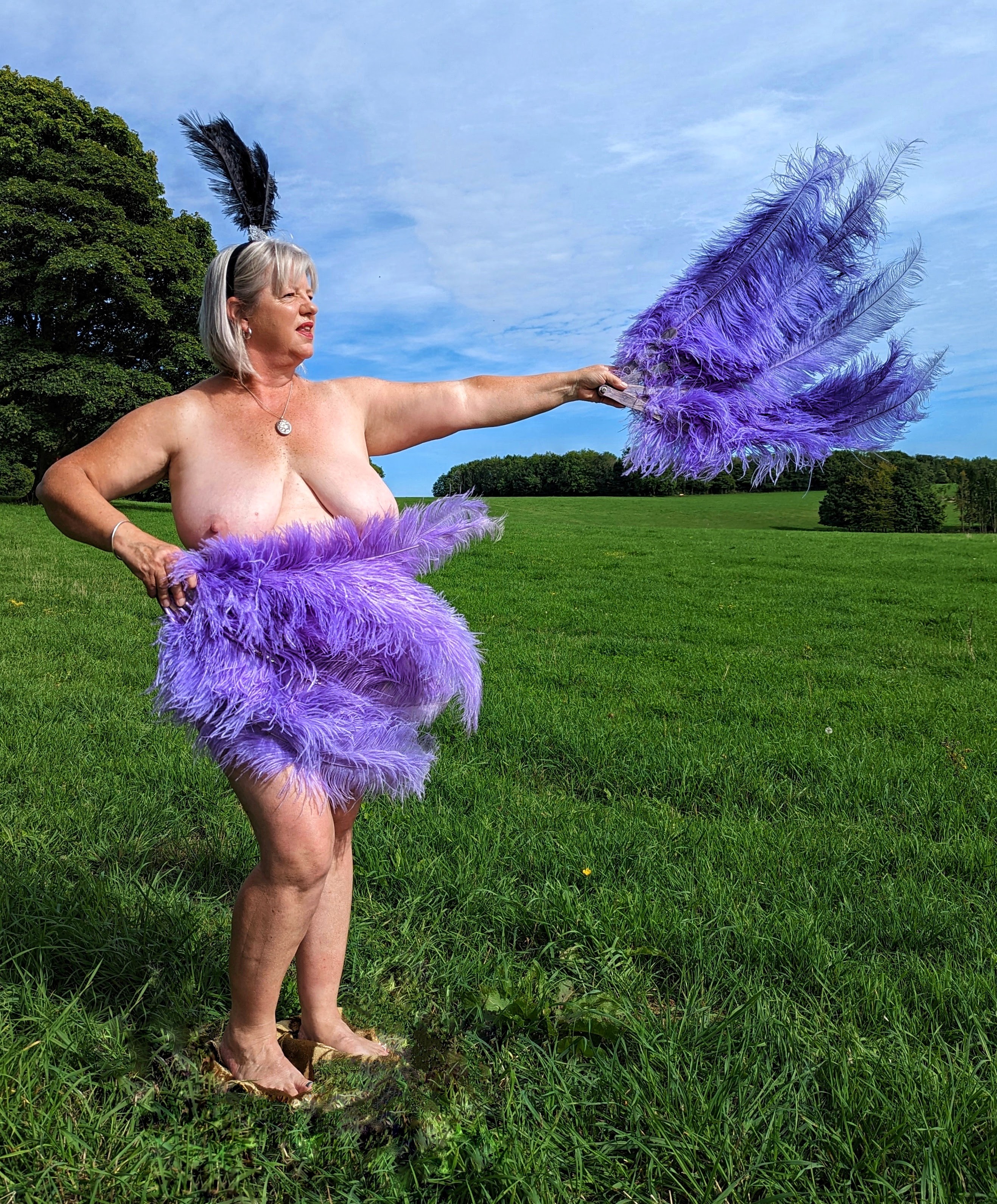 Lucy naked but for feathers.