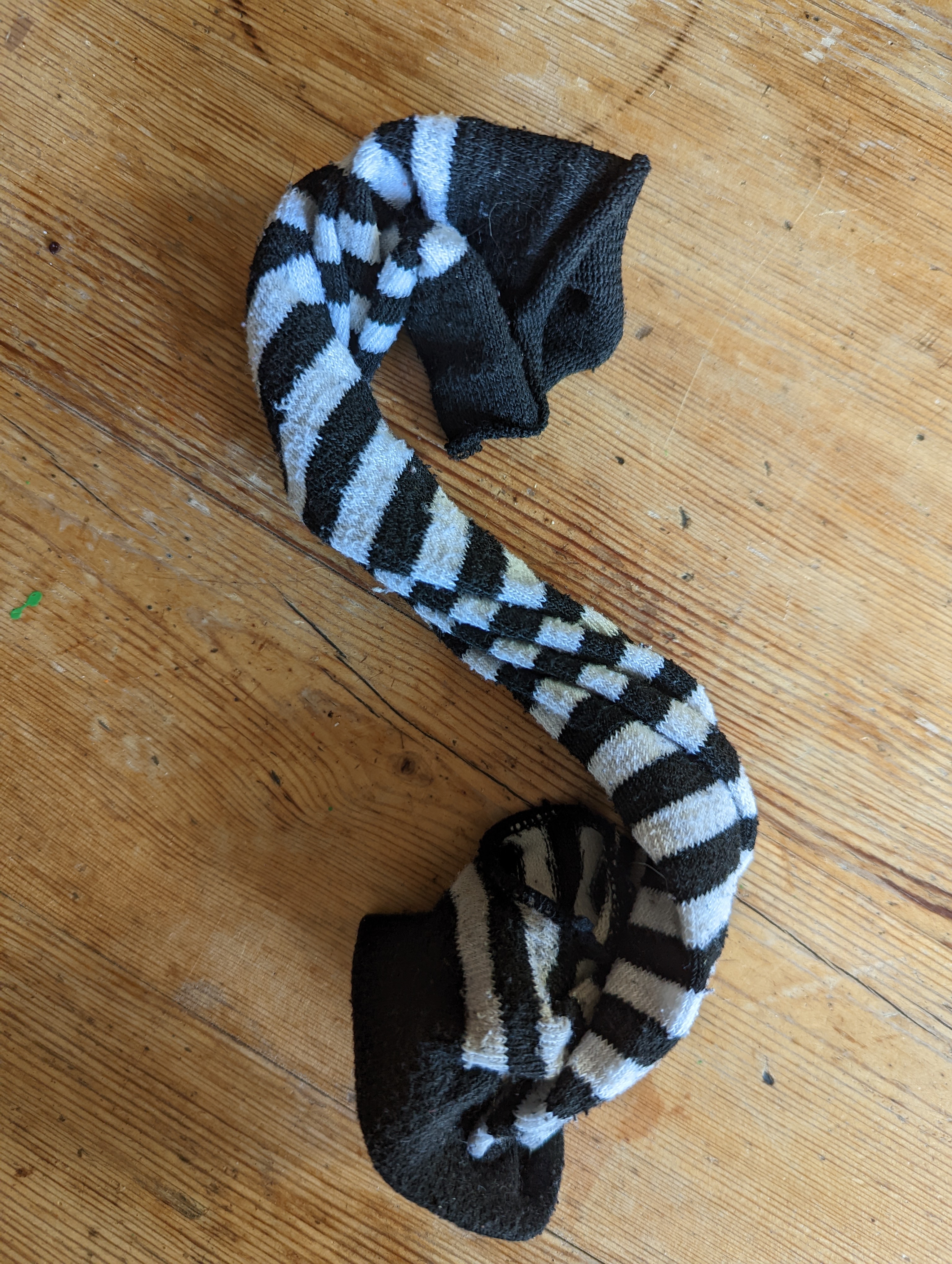 A photograph of Lex's offering which is one of the stripped fingerless gloves, as worn in the other photos.