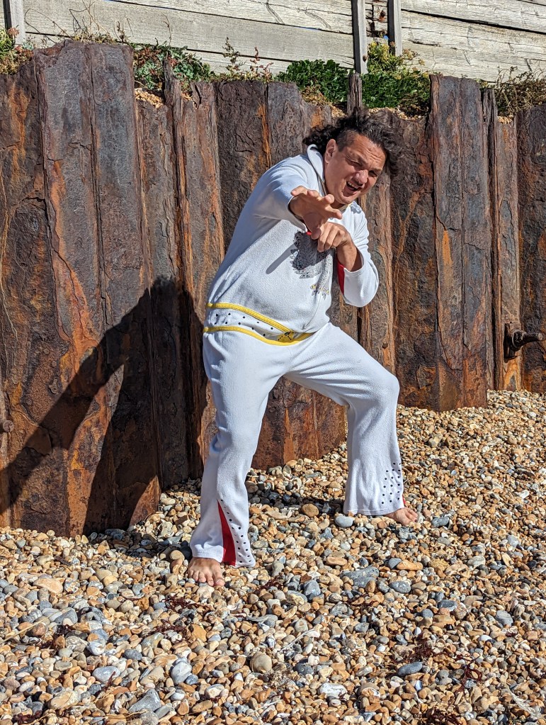 Carl in Elvis style onesie - reach.
