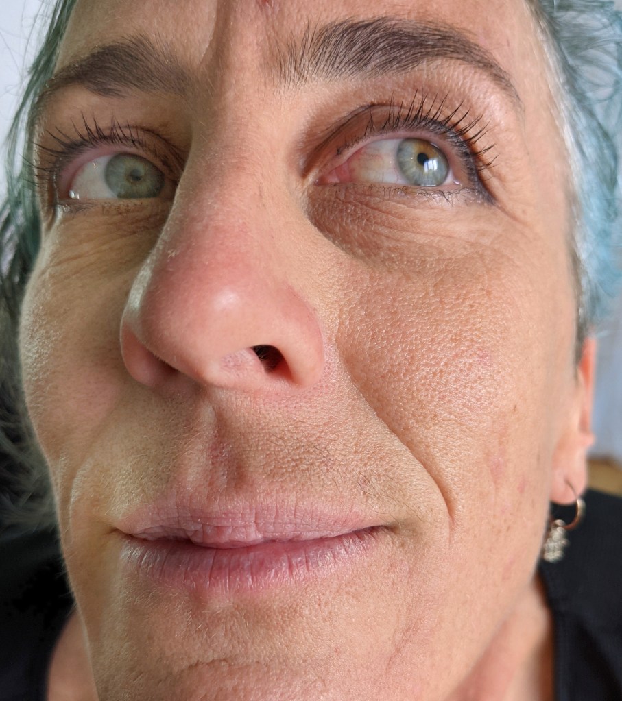 Trying to show me the hair on her lip.